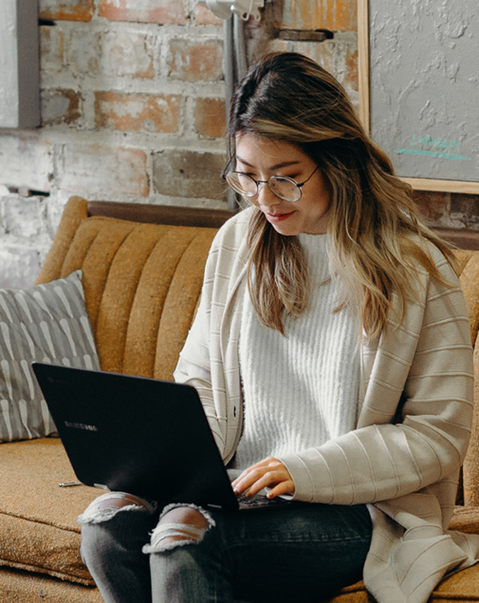 woman working on laptop, cozy setting