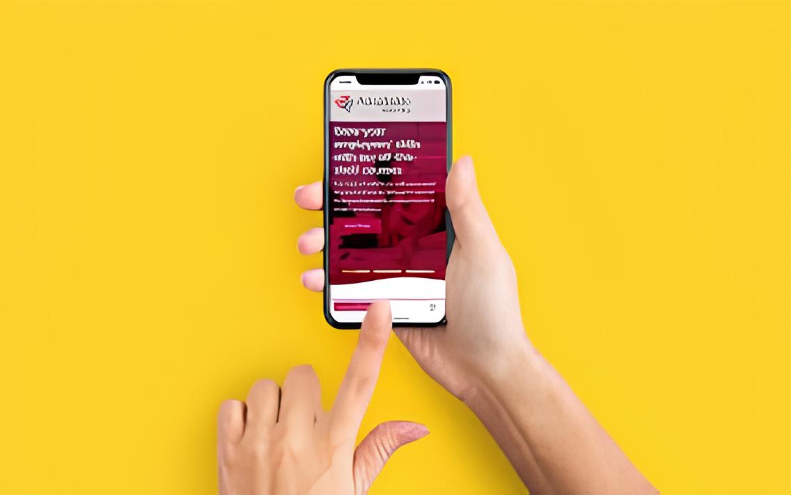 hand holds phone, website displayed