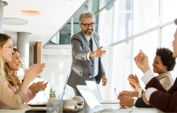 leader celebrates success with team