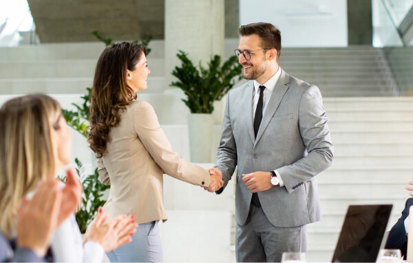 business partners shake hands, closing deal