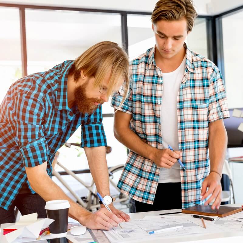two men collaborating on design