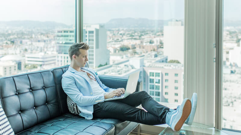 man working on laptop with a view