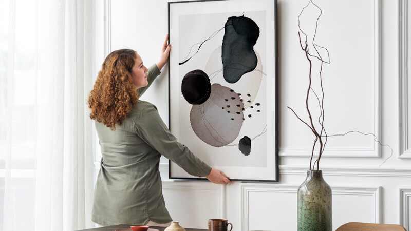 woman hanging modern abstract art