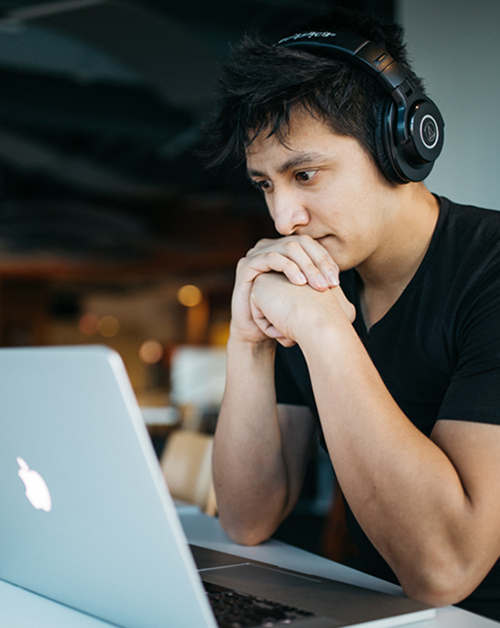 focused man job hunting online